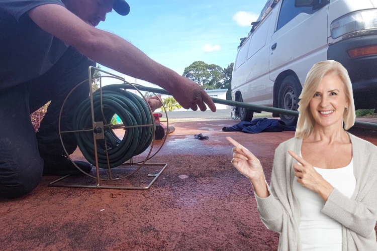 Hose neatly coiled, a batemansbay specialist finishes up a day of thorough gutter rinsing.