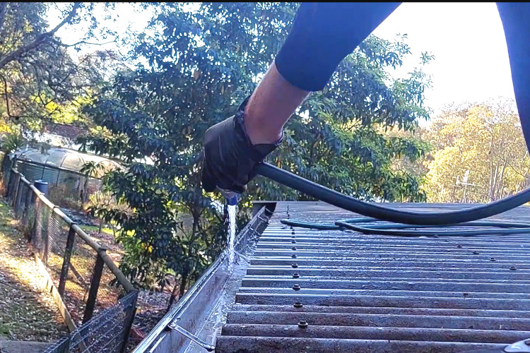 A garden hose proves to be a valuable asset for the gutter cleaning company in batemansbay, delivering exceptional results during their cleaning efforts.